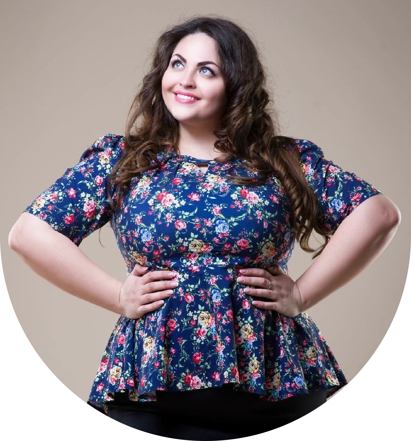 A woman in floral print top posing for the camera.